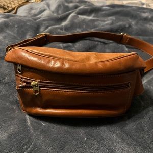 All leather. Can be used as Fanny pack or cross body. Excellent condition.